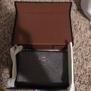 Gray wristlet never been out of the box.